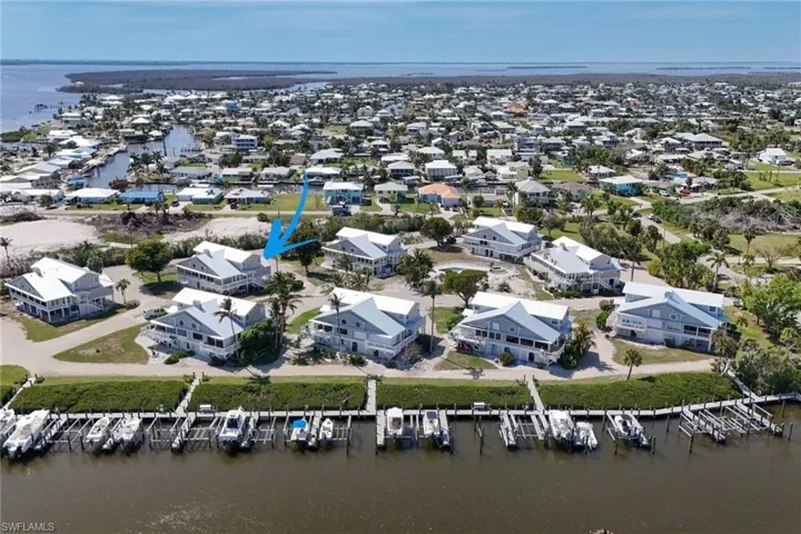 Aerial view of residential area with a nearby body of water