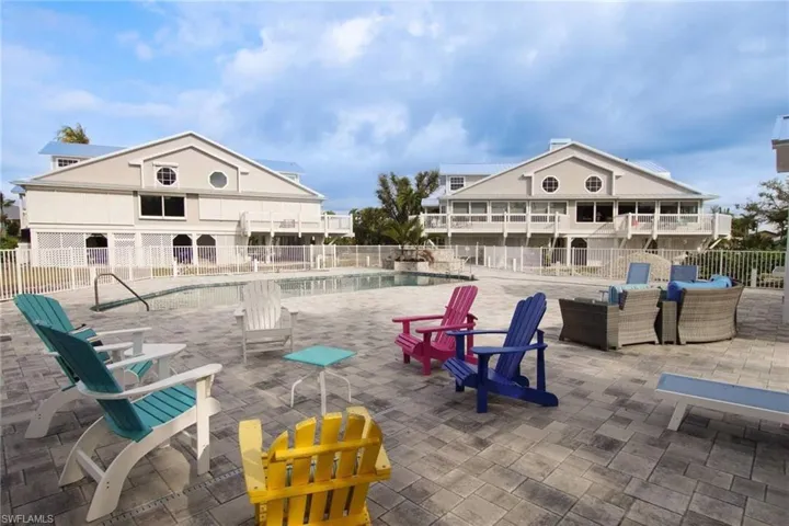 View of patio with a community pool
