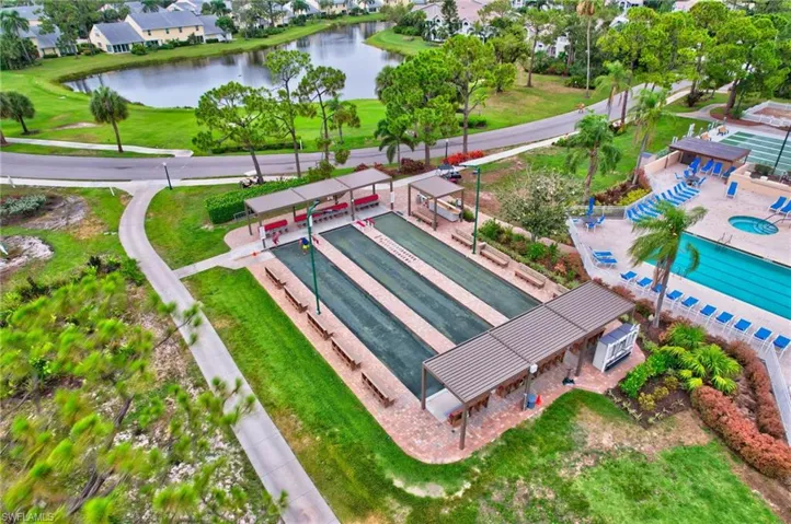 Bird's eye view of a large body of water, a pool area, and a golf club