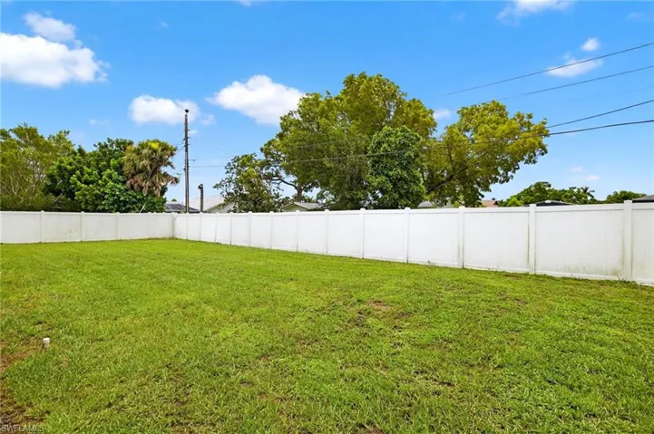 View of fenced backyard