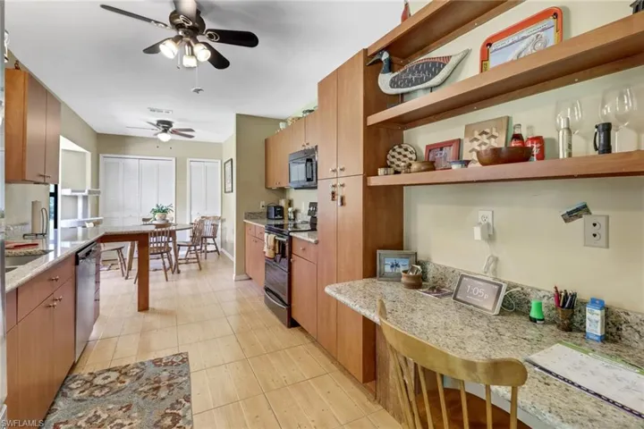 Kitchen with ceiling fan and stainless steel appliances