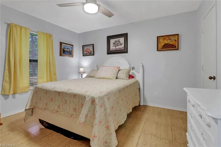 Bedroom featuring light wood-type flooring and ceiling fan