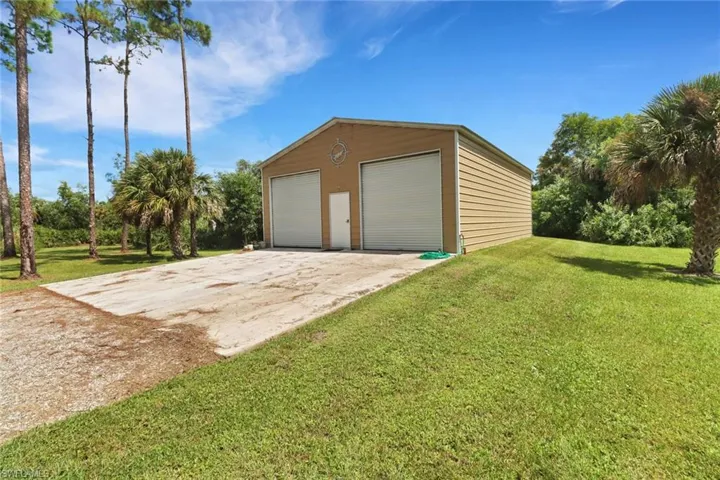 Garage with a lawn
