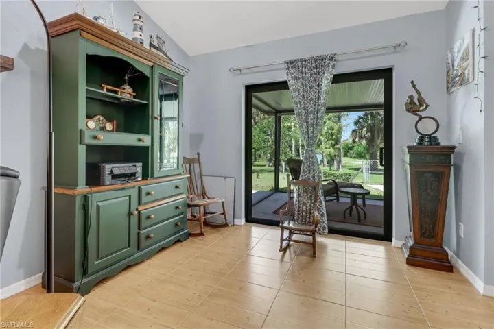 Sitting room featuring vaulted ceiling