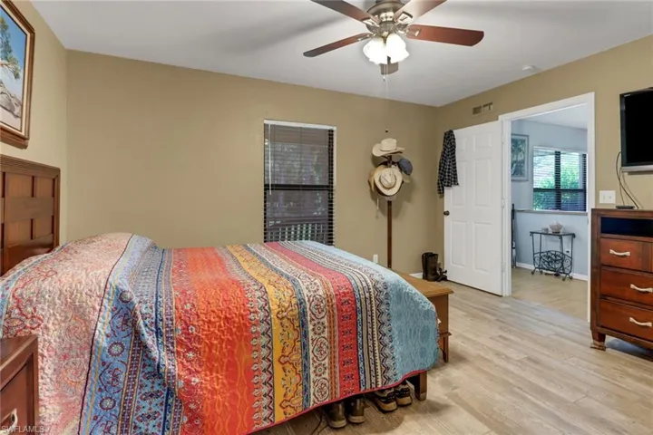 Bedroom featuring ceiling fan and light hardwood / wood-style flooring