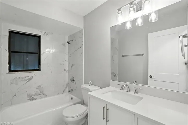 Bathroom featuring vanity and shower / bathtub combination