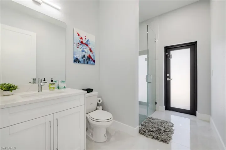 Bathroom with vanity and a shower stall
