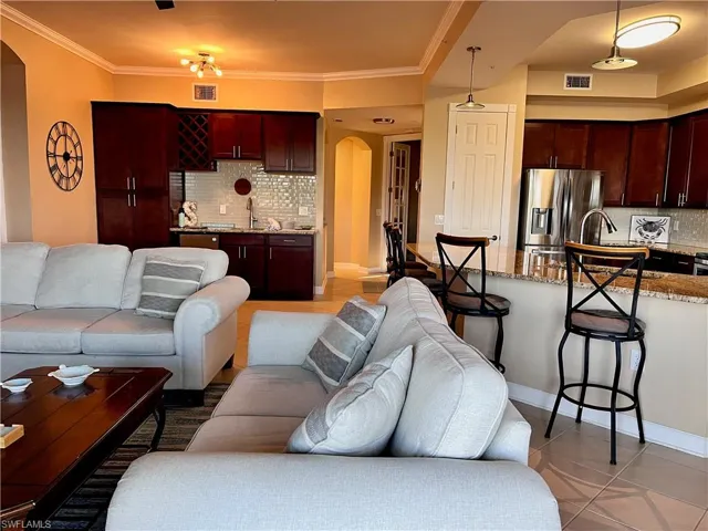 Customized wet bar area with wine refrigerator and lots of storage