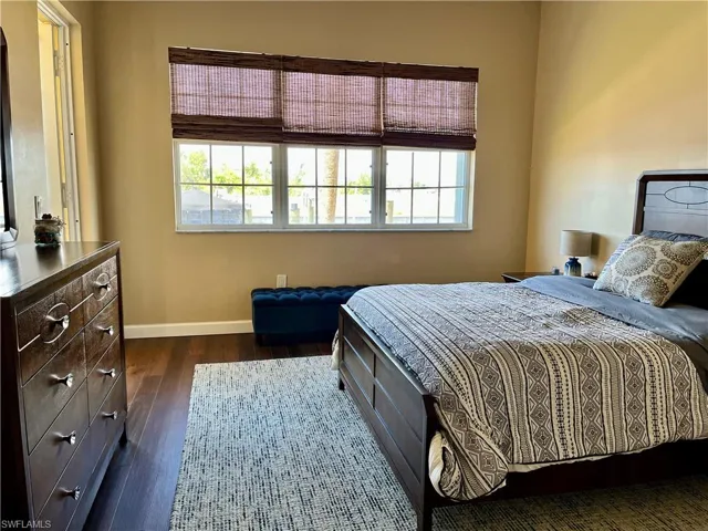 Walk in shower, dual sinks, separate toilet area and linen shelving