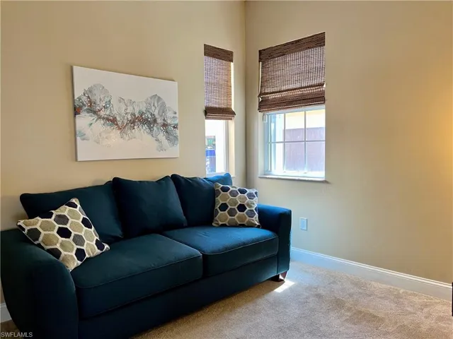 Laundry area with storage closet and extra cabinets