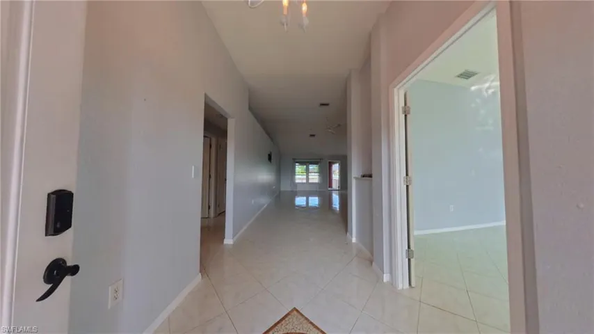 Entry area featuring tiled floors