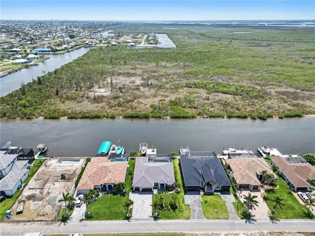 Aerial view of the property and its surrounding area