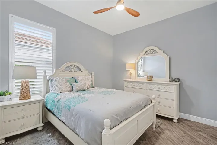 This room features gray walls, and wood-look tile flooring