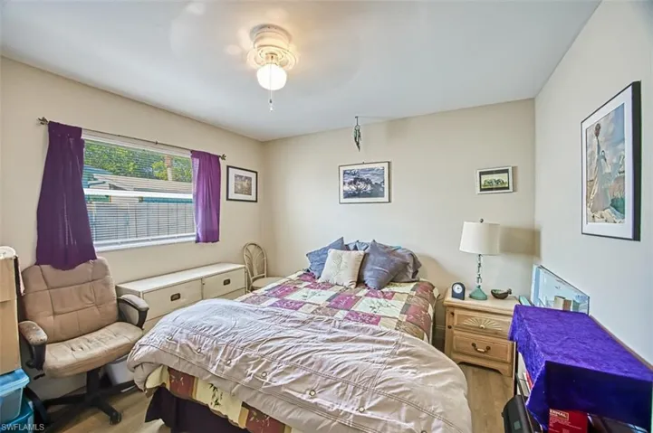 Bedroom featuring wood-type flooring