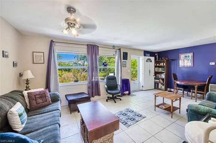 Tiled living room with ceiling fan