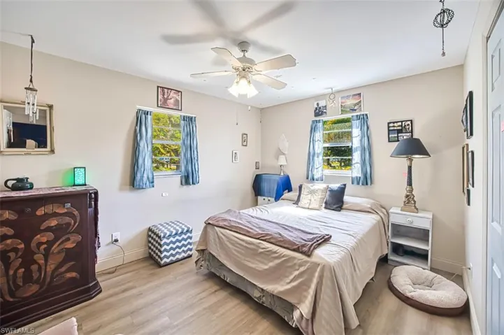Bedroom featuring ceiling fan and light wood-type flooring