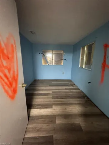 Spare room with hardwood / wood-style flooring