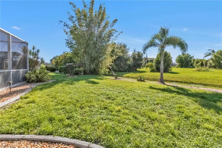 View of yard featuring a lanai