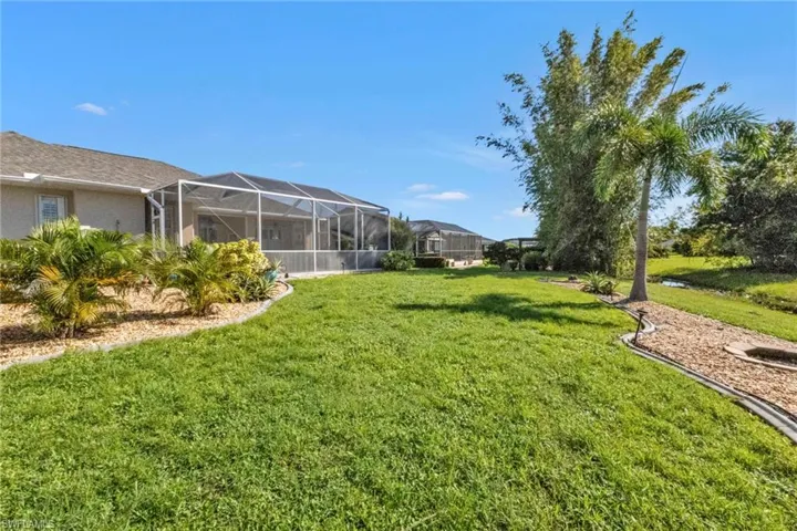 View of yard featuring a lanai