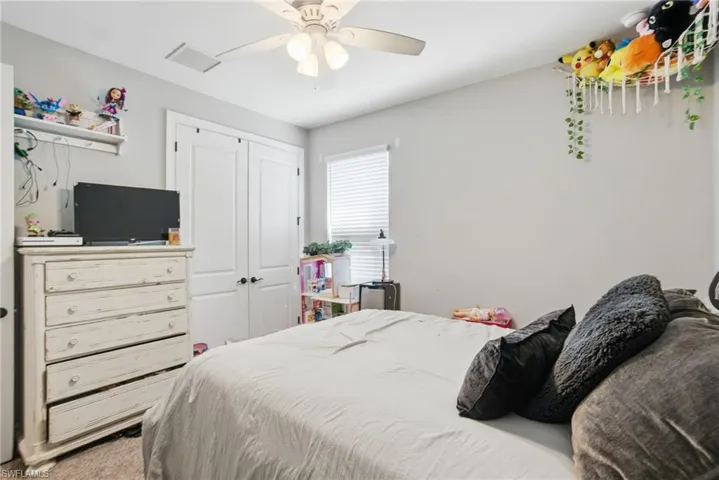 Bedroom with a closet and ceiling fan