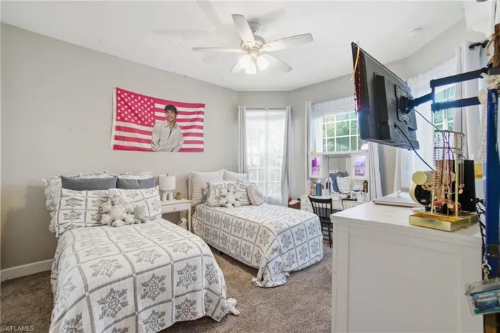Bedroom with carpet and a ceiling fan