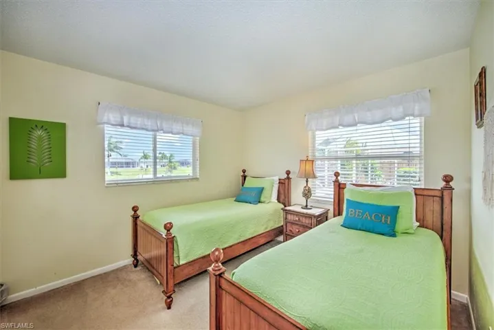 Bedroom with light carpet
