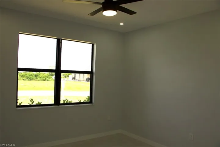 Unfurnished room featuring ceiling fan and recessed lighting