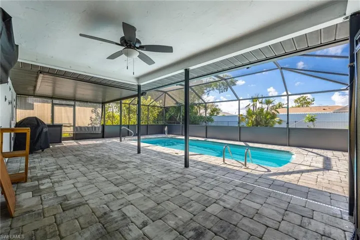 Aerial perspective of suburban area with a pool area