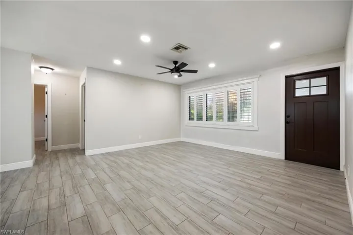Full bath featuring a shower stall and vanity