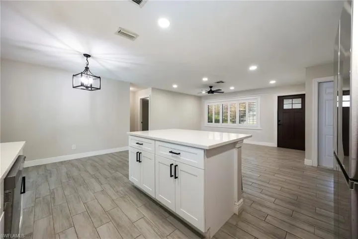 Foyer entrance featuring wood finish floors, recessed lighting, and a ceiling fan