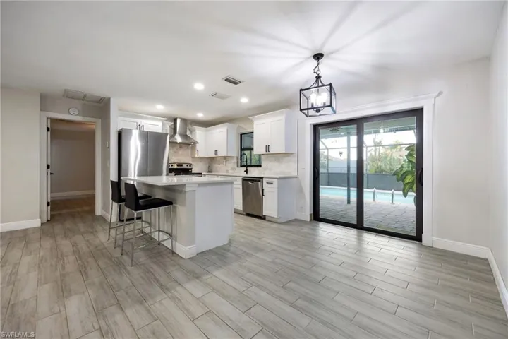 Entrance foyer featuring recessed lighting, light wood-style floors, and a ceiling fan