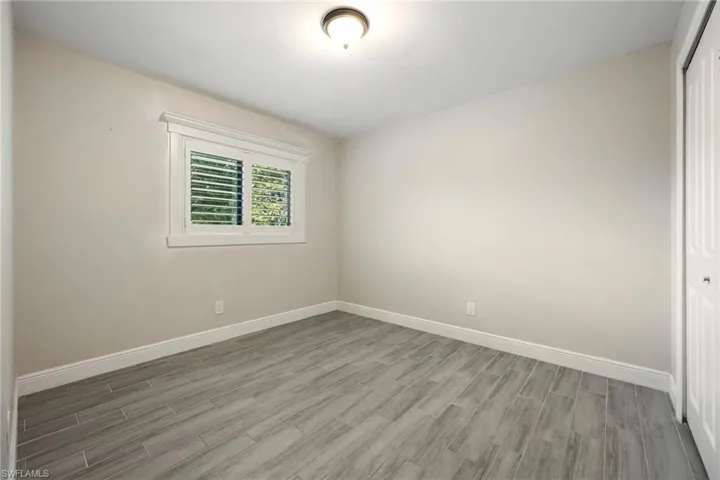 Full bathroom featuring shower / bath combo with shower curtain and vanity