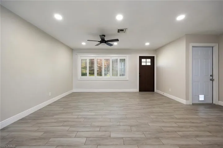 Bedroom featuring wood finish floors and a ceiling fan