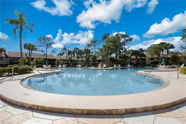 Community pool with a patio area