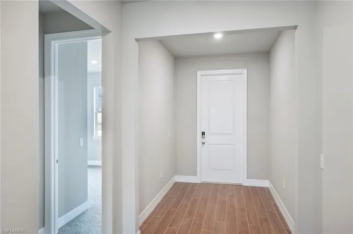 Hallway featuring light wood-type flooring
