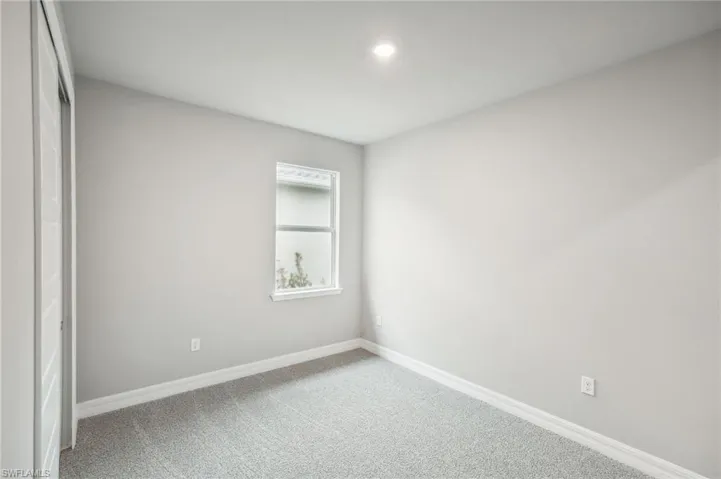 Unfurnished bedroom with carpet floors