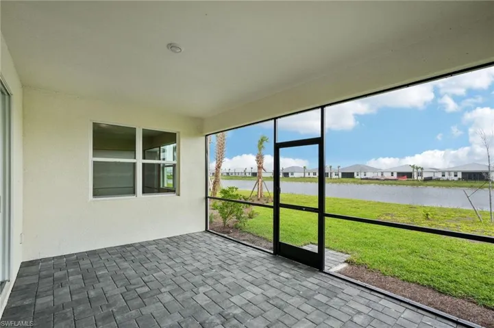 Unfurnished sunroom with a water view