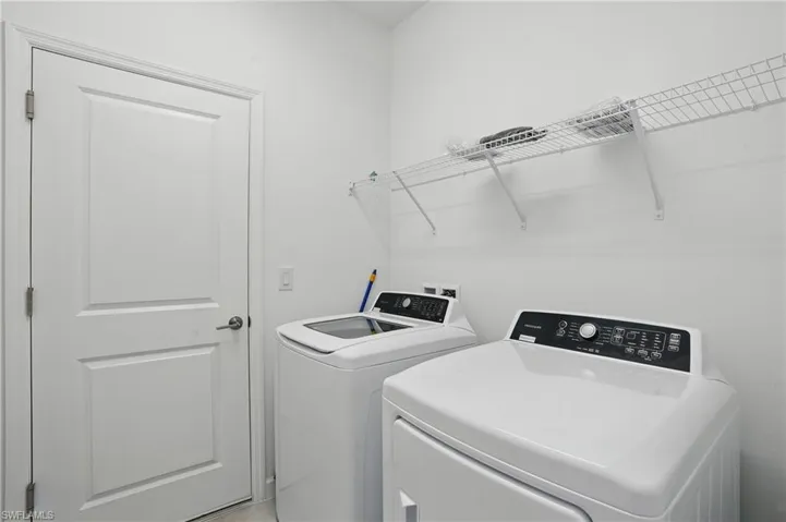 Laundry room with washing machine and dryer