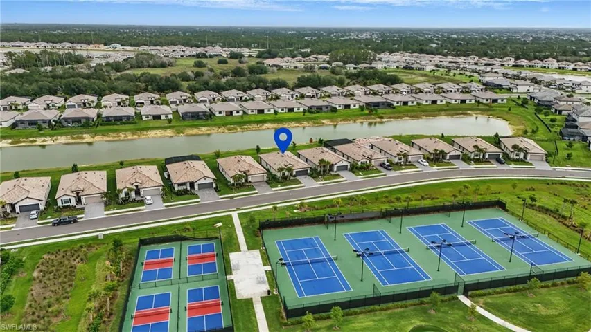 Aerial perspective of suburban area with a large body of water
