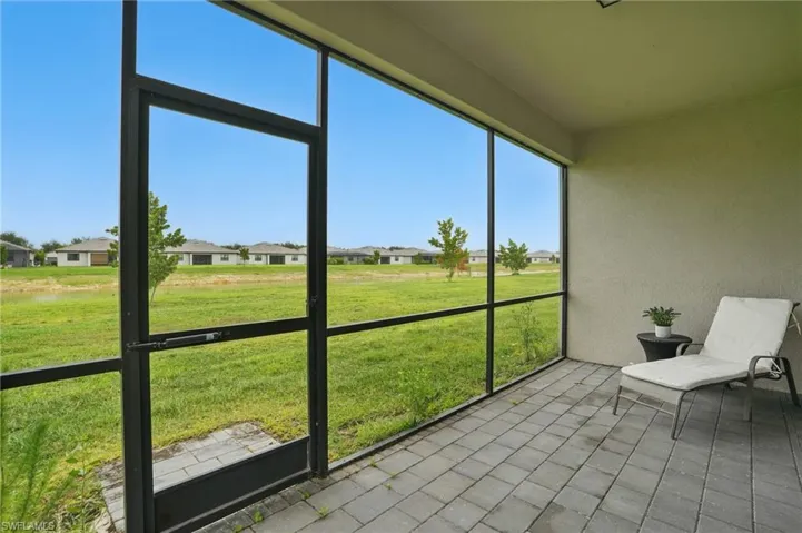 Sunroom featuring a residential view