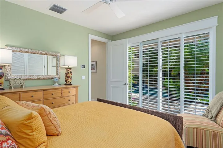 Bedroom with a ceiling fan and access to exterior