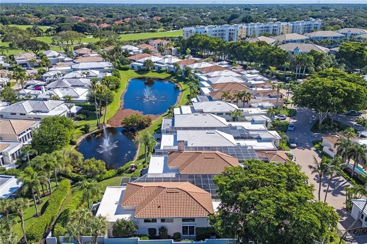 Aerial perspective of suburban area with a large body of water