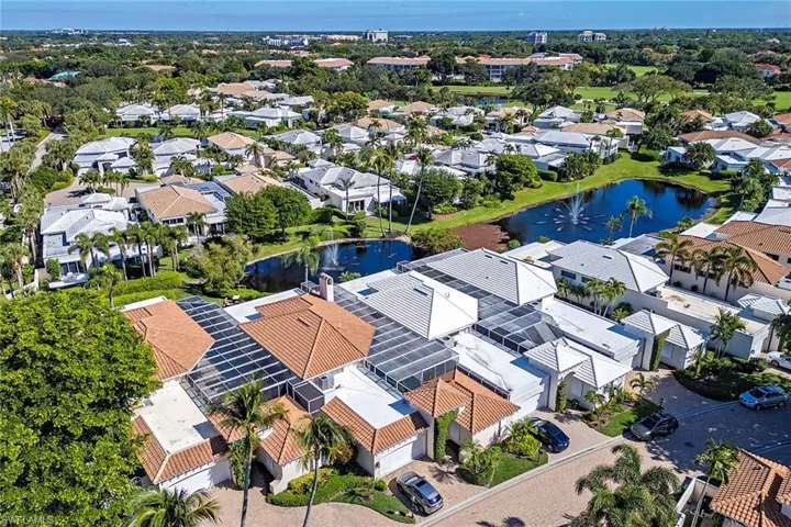 Aerial perspective of suburban area with a large body of water