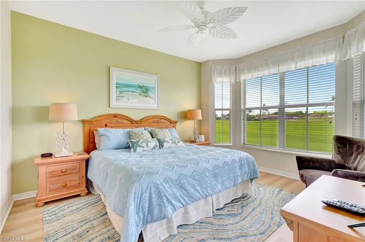 Bedroom with ceiling fan and light hardwood / wood-style floors