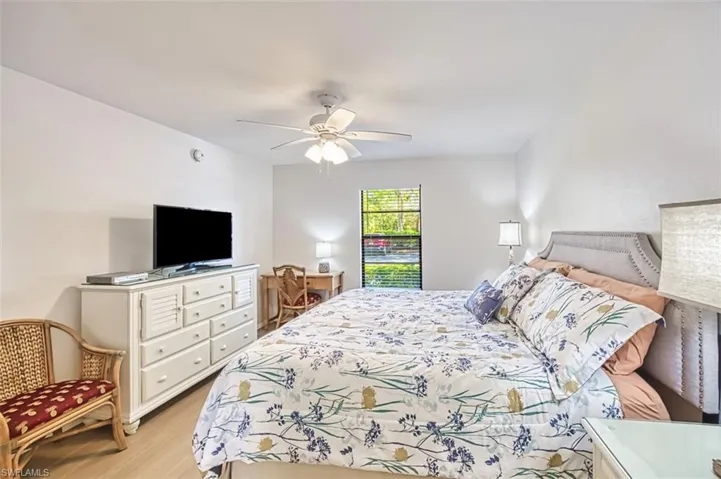 Bedroom featuring light wood finished floors and a ceiling fan
