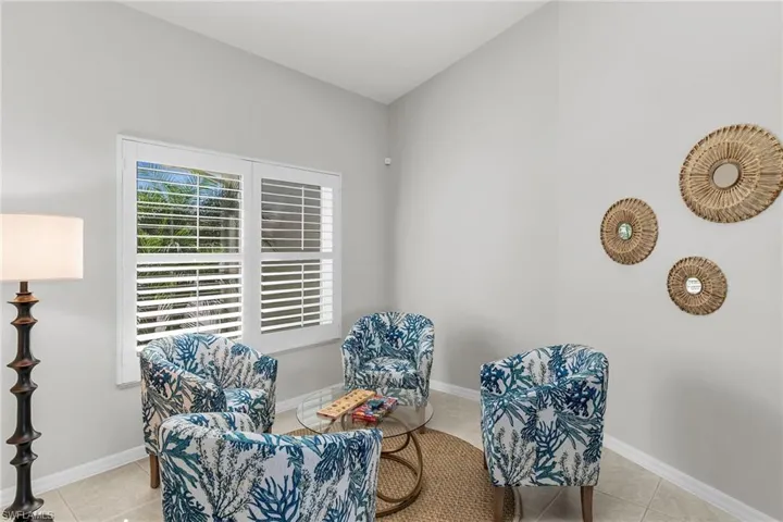 Sitting room featuring tile patterned flooring and baseboards