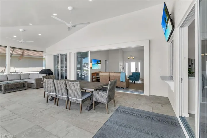 View of patio / terrace featuring outdoor lounge area, a ceiling fan, and outdoor dining space