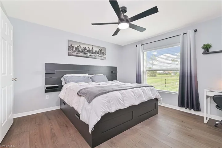 Bedroom featuring wood finished floors and a ceiling fan