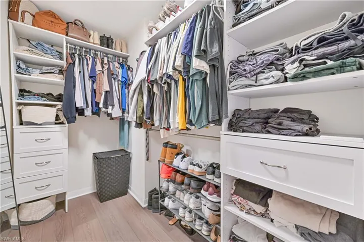 Spacious closet featuring light wood finished floors