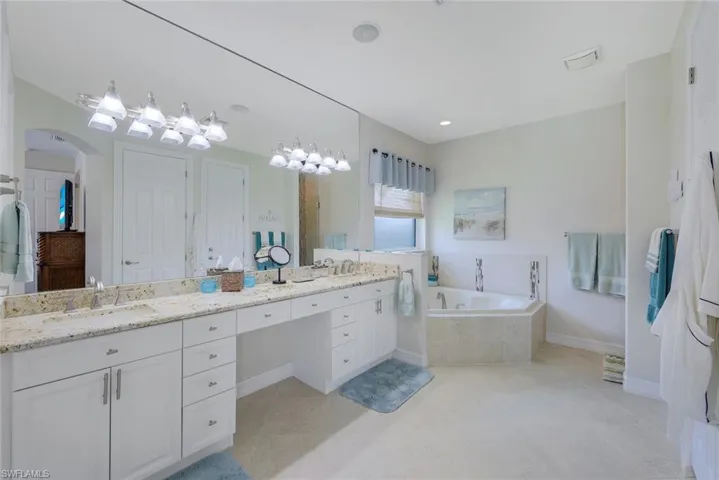Primary bath with Roman tub and separate walk-in shower.